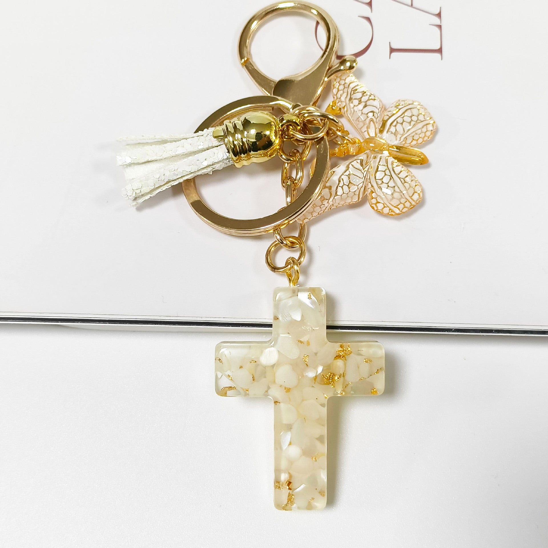 Wholesale Resin glue cross butterfly white blue tassel keychains