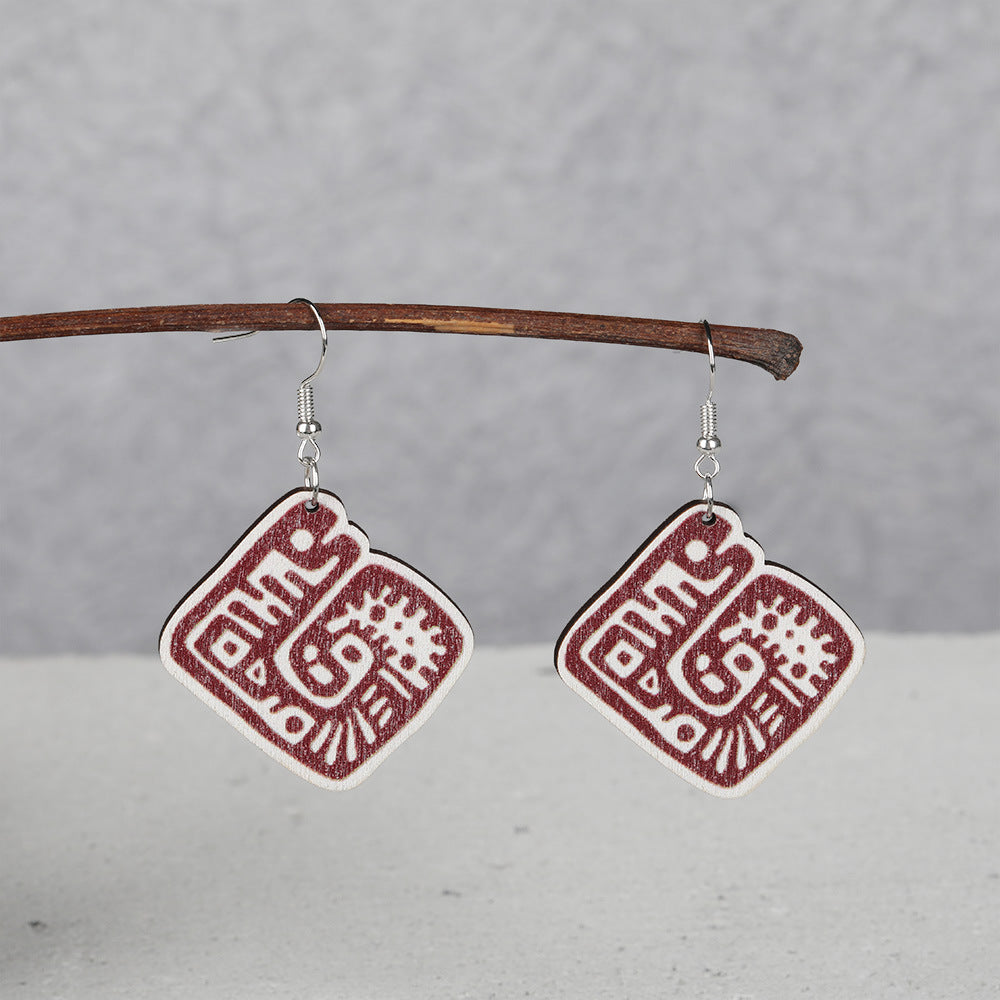 Wholesale wooden animal and Mayan image earrings