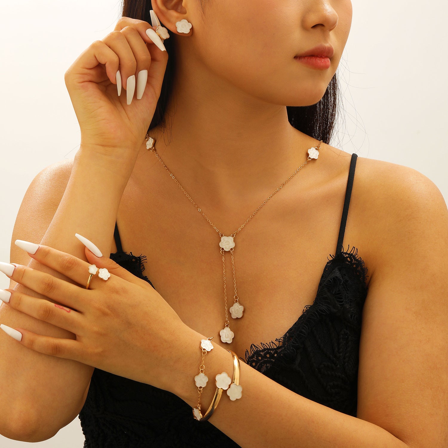 Collana, bracciale e orecchini con quadrifoglio all'ingrosso