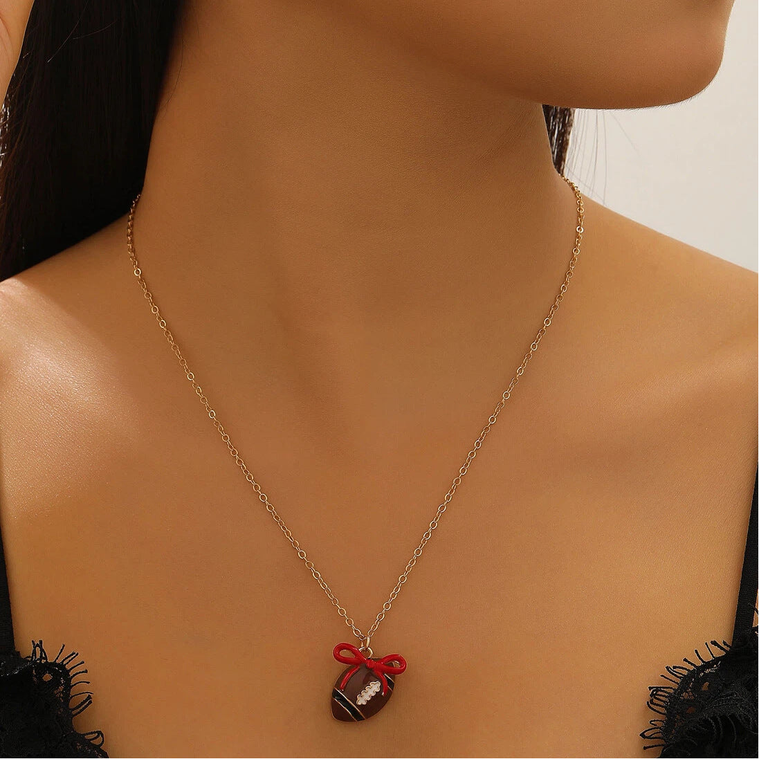 Wholesale sports style football love bow  necklace