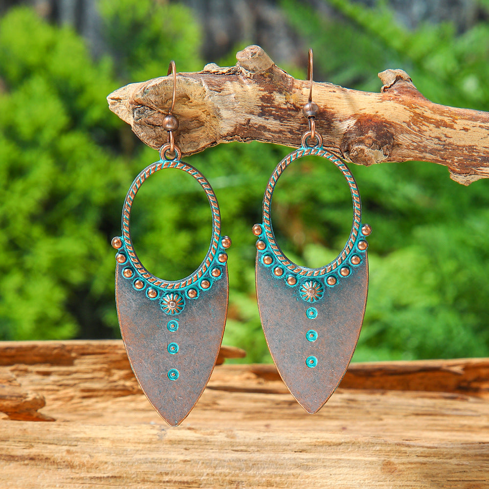 Wholesale Retro Bohemian Turquoise Heart Hollow Leaves Alloy Earrings for Party Wear Boutique Resale Jewelry
