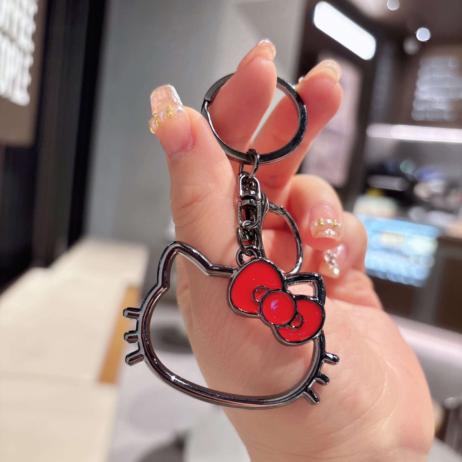 Wholesale hollow paint KT cat alloy key chain cute cartoon girl bag decoration