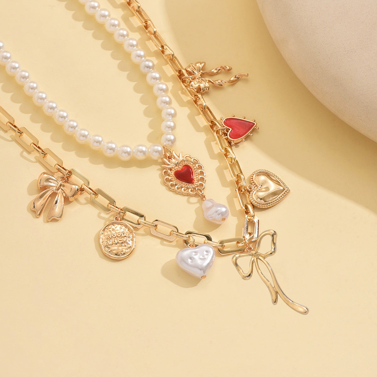Wholesale creative vintage alloy heart and bow multi-pendant layered  necklace