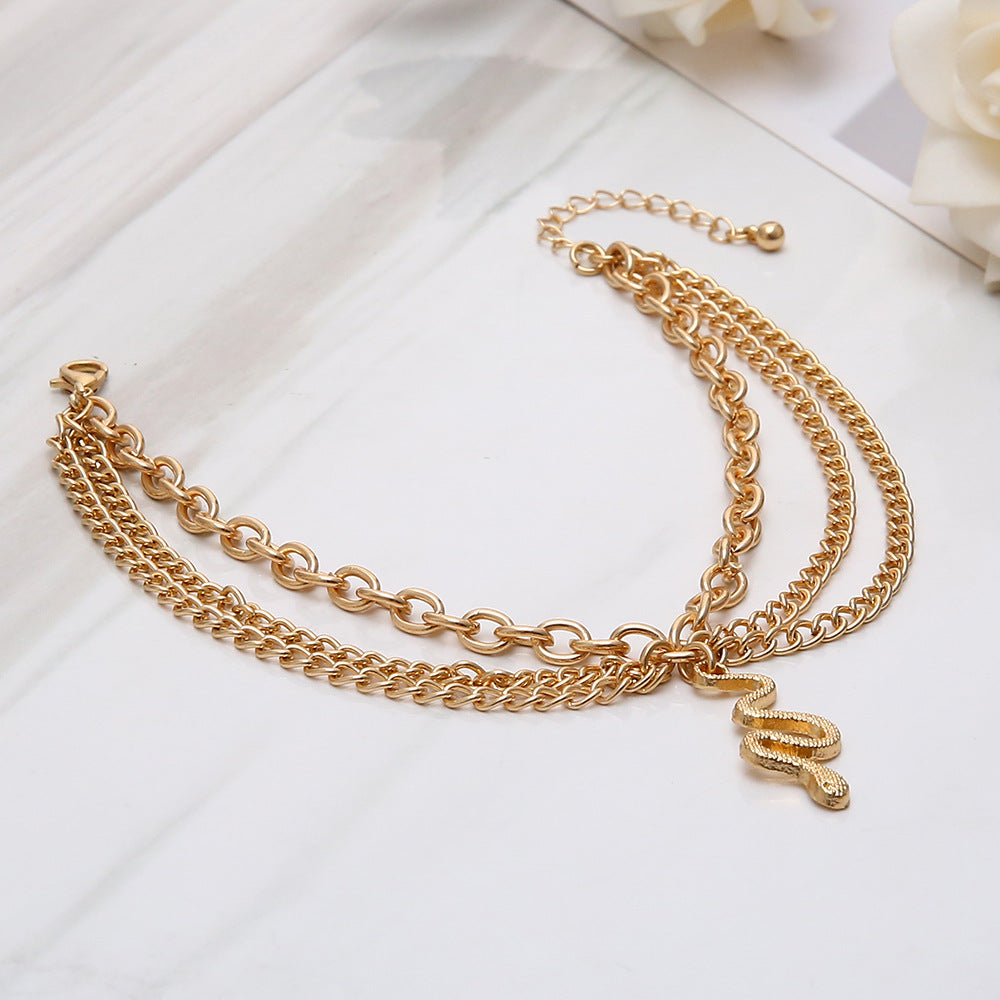 Wholesale Alloy Golden Cross Tassel Snake Pendant Three Layer Anklet for Women