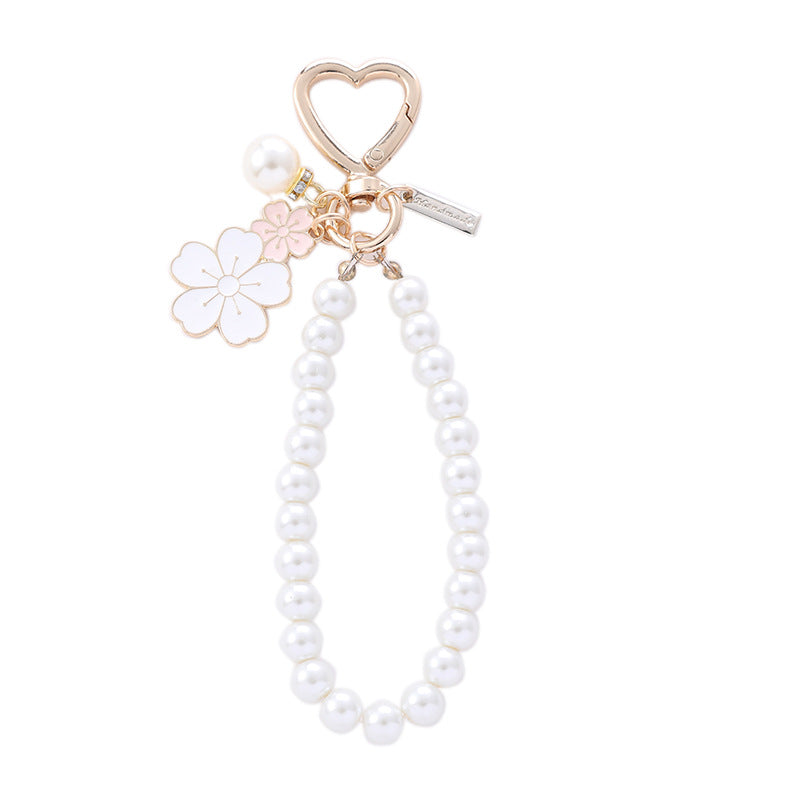Wholesale two-color flower pearl alloy wrist keychain