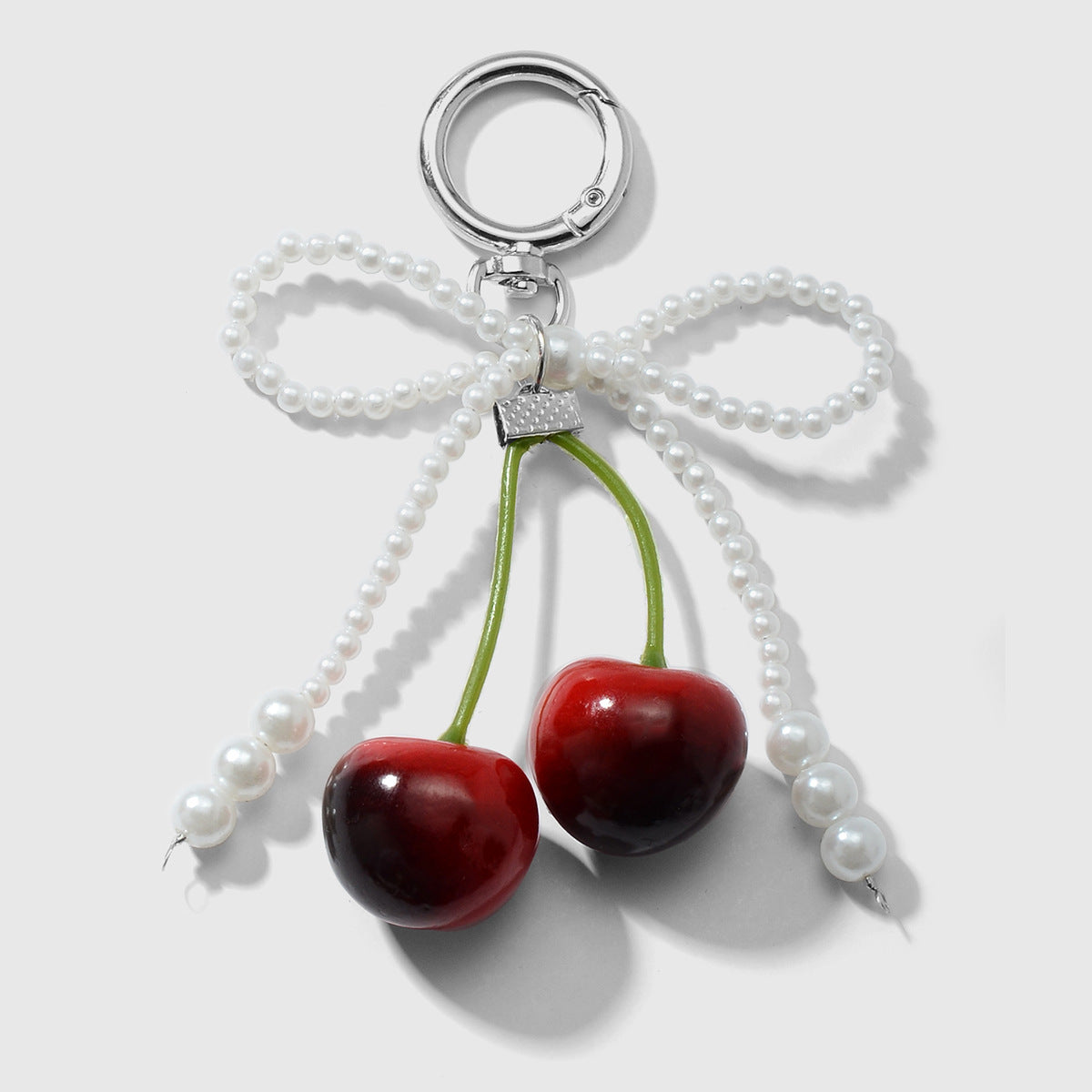 Wholesale Zinc alloy artificial pearl lace leopard print bowknot cherry keychain