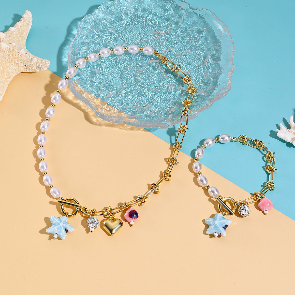 Wholesale  best-selling trendy pearl heart necklace and bracelet set for women  featuring a luxurious and sophisticated ocean-themed design