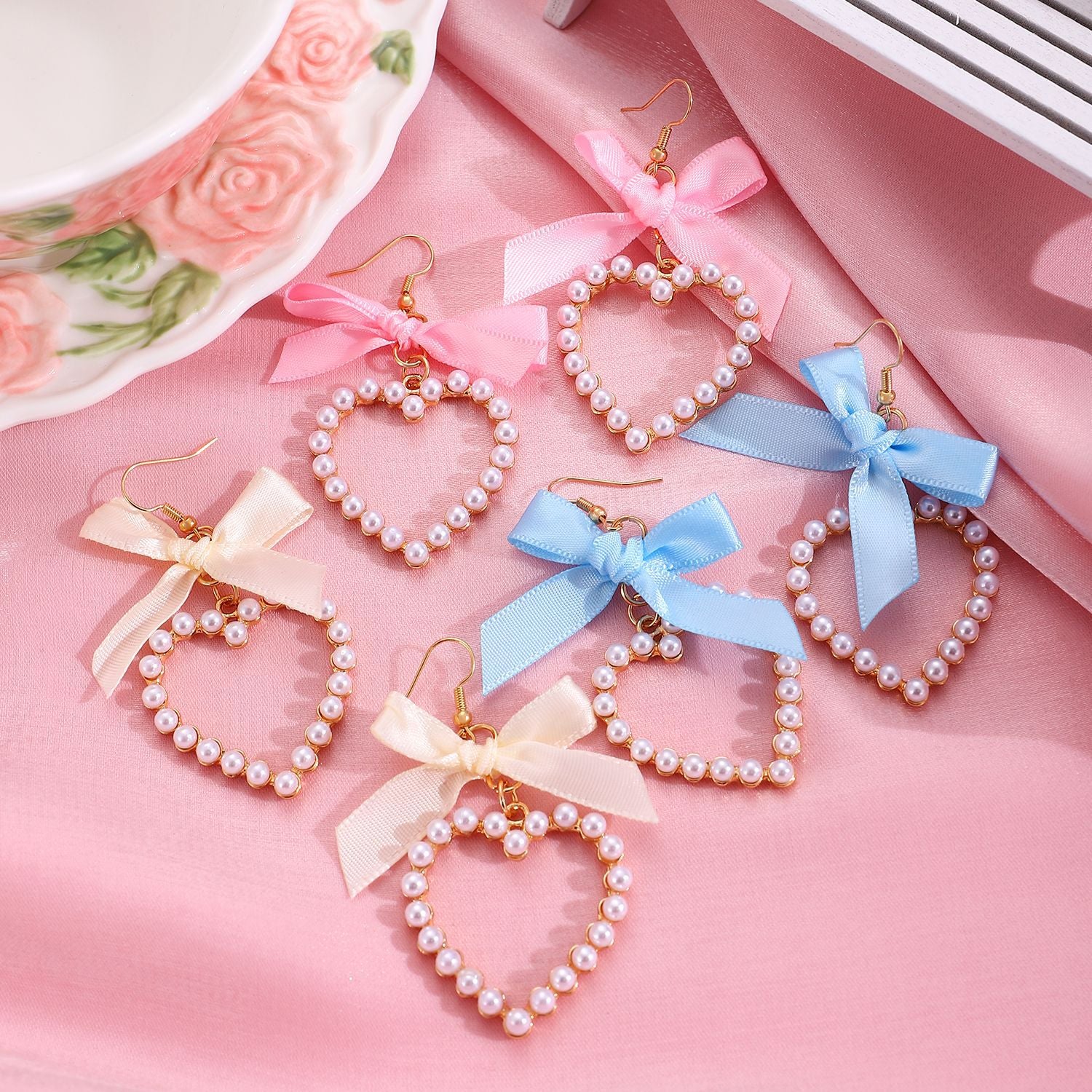 Wholesale Heart-shaped bow man-made pearl earrings