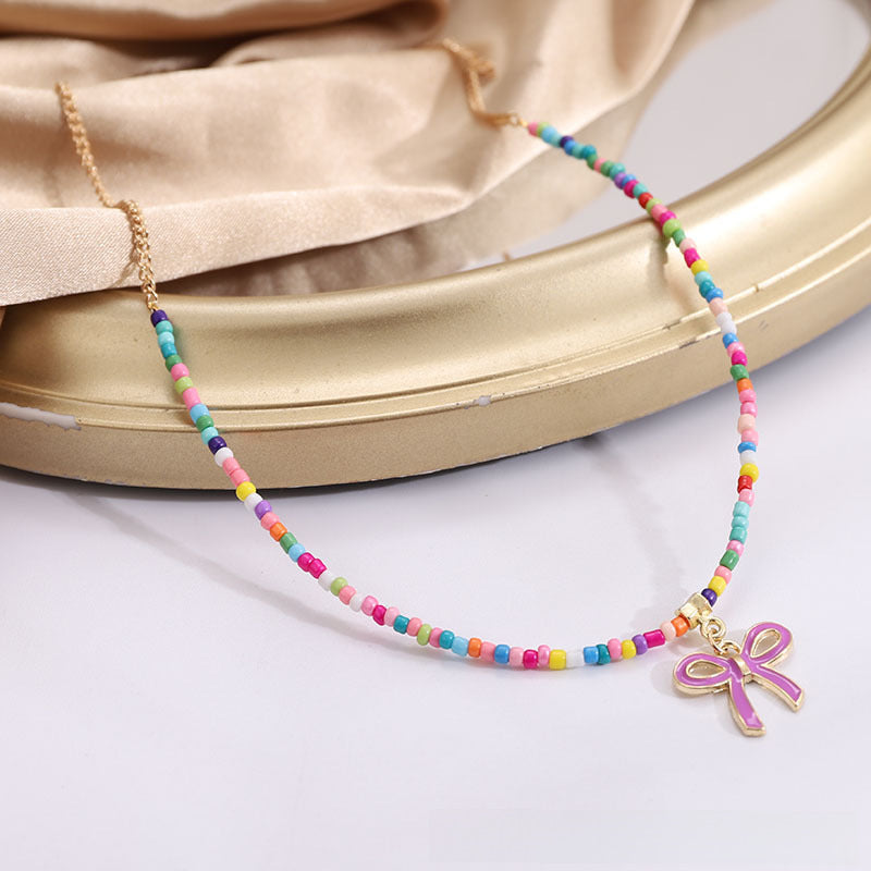 Wholesale Bohemian Rice Bead Single Layer Alloy Oil Drop Bowknot Necklace