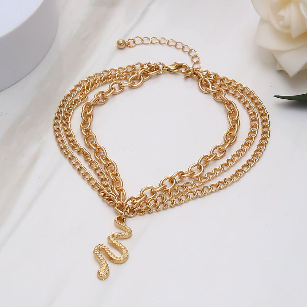 Wholesale Alloy Golden Cross Tassel Snake Pendant Three Layer Anklet for Women