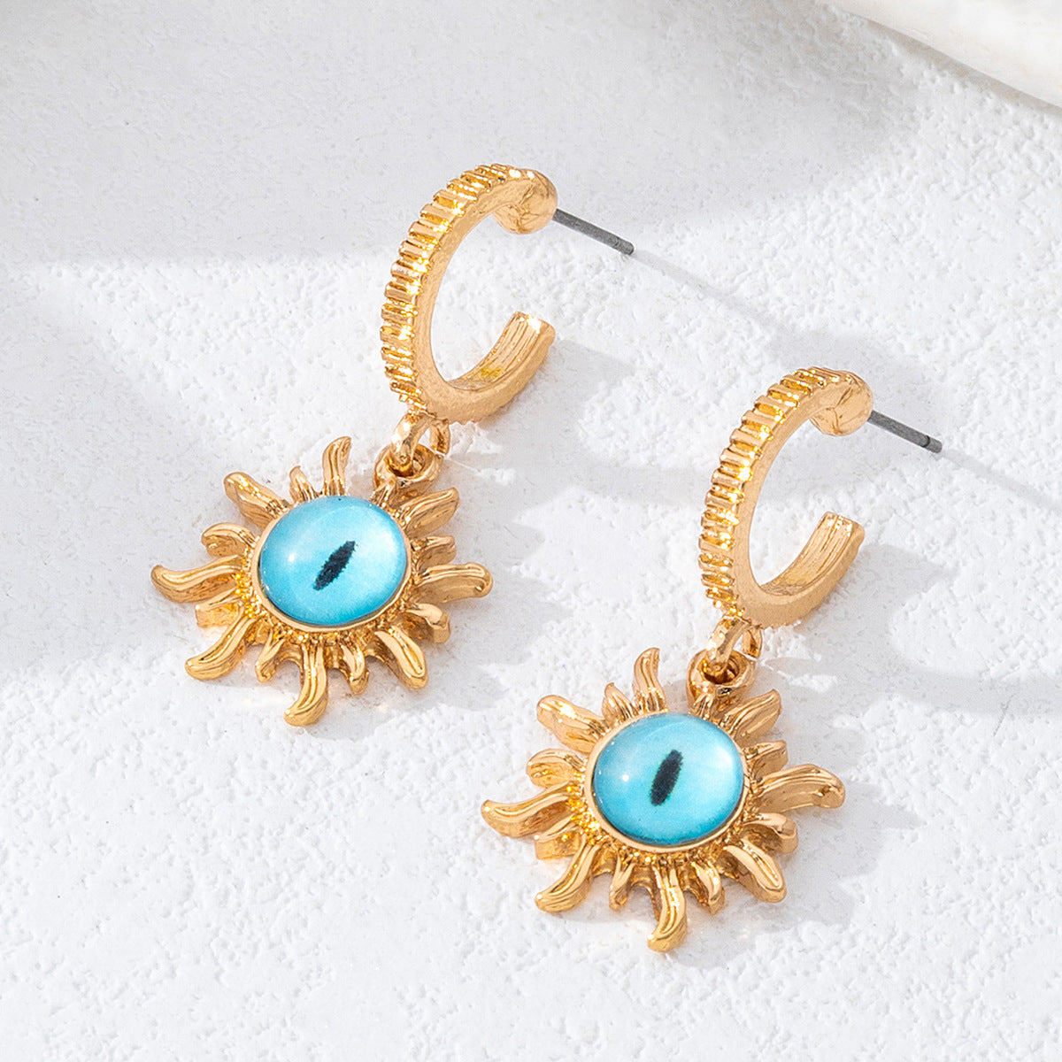 Wholesale zinc alloy drip-print devil eye earrings luxurious irregular eye earrings.