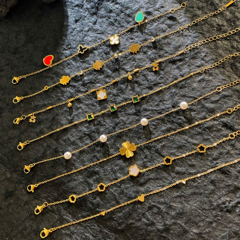 Wholesale Titanium Steel Gold Plated Laser Four Leaf Clover Pearl Bracelet ACC-BT-YuXun005